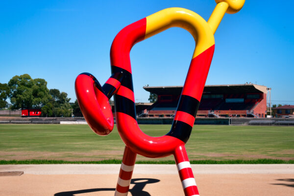 Abstract sculpture resembling a figure with bold shapes and colours